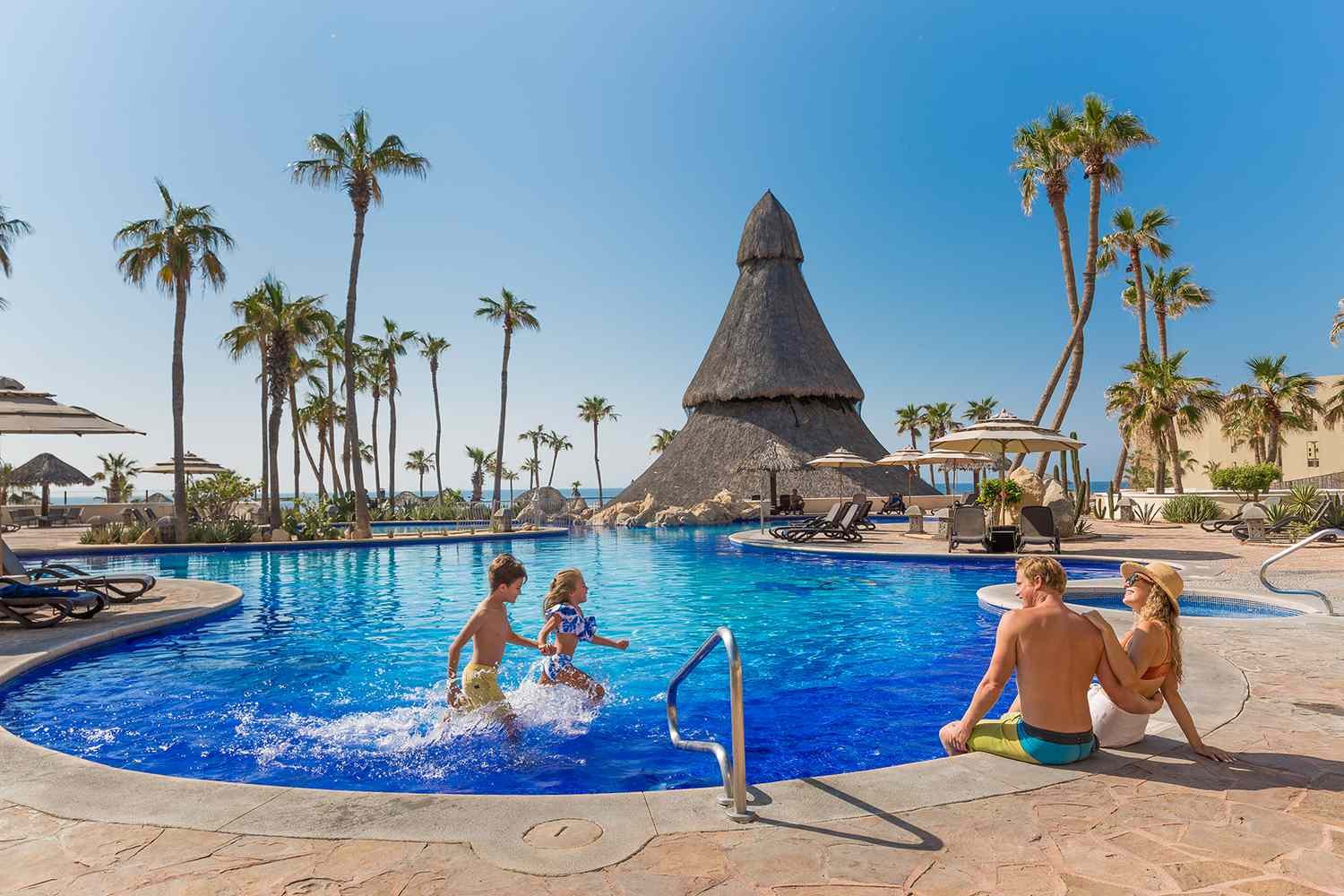 a family at a pool showing a family-friendly hotel