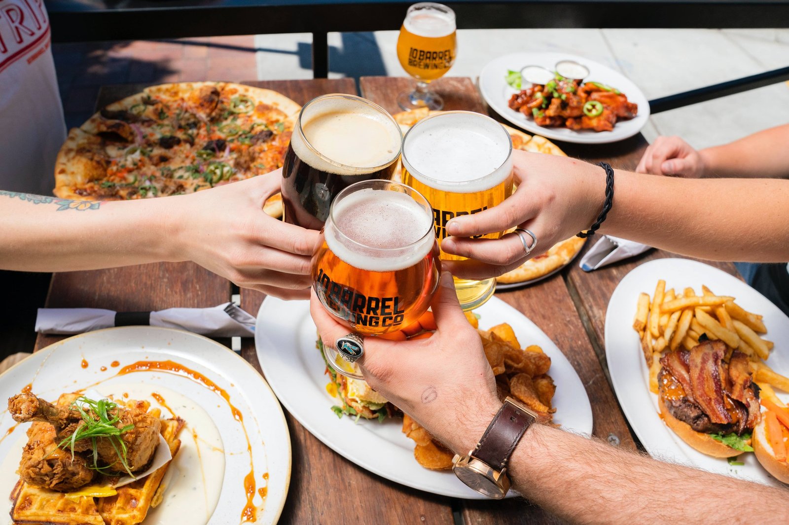 a group of people having a Delicious Food and Beverage