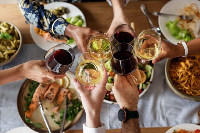 a group of people having a Delicious Food and Beverage